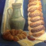 «Тёплый натюрморт: хала, кувшин и клетчатая салфетка».
